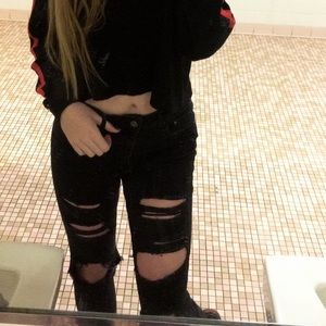 Distressed black ripped jeans + two belts